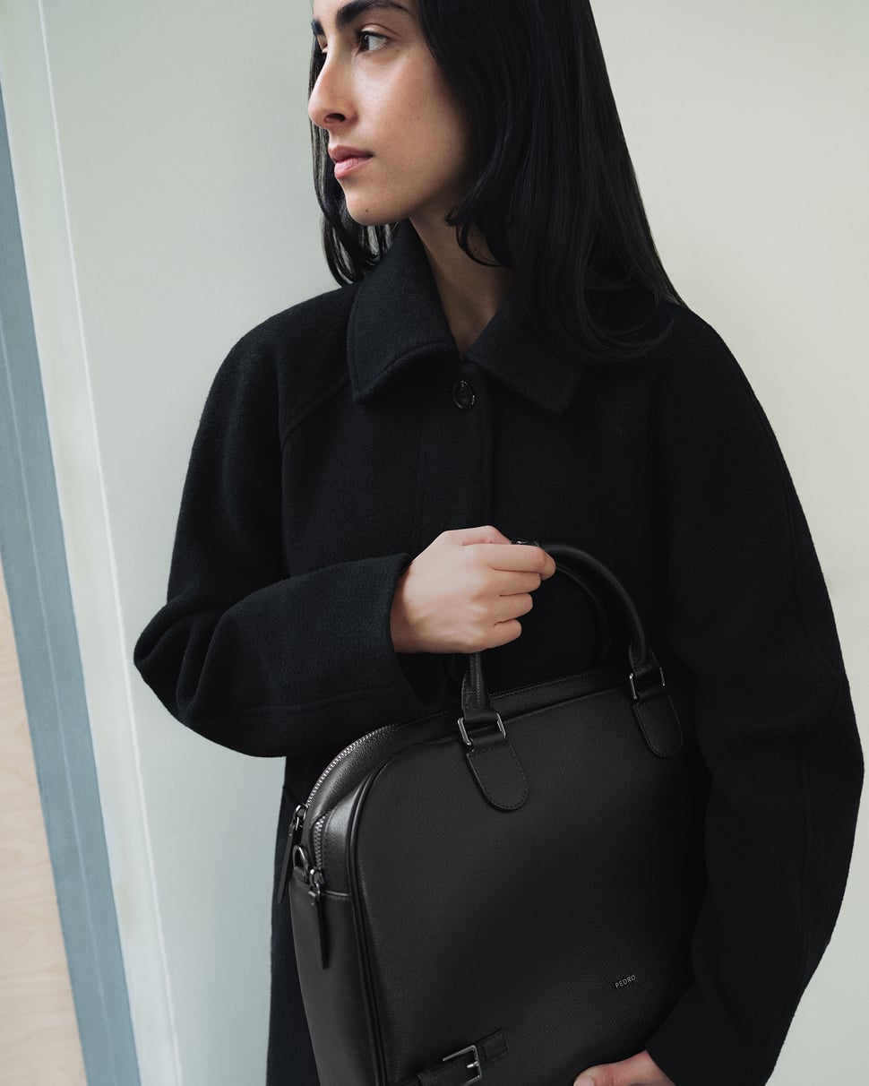 Tahni Bouhadana holding a black PEDRO bag